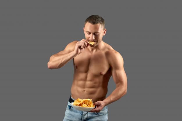 bodybuilder eating chips cheat meal 7502 2680